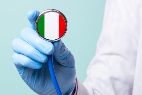 Medicine in Italy is free and paid. Expensive medical insurance. Treatment of disease at the highest level Doctor holding a stethoscope in his hand